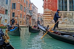 gondoliers on the canal in venice