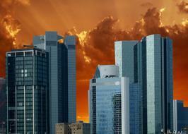 Shiny skyscrapers in Frankfurt, Germany, at colorful sunset, with the clouds, clipart