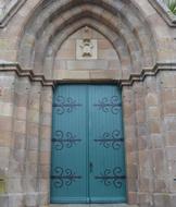 Beautiful and decorated blue and green door of the church