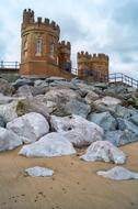 A large castle with stones