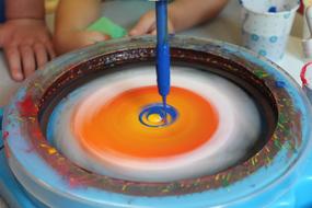 Preschool kids, playing with the colorful paint