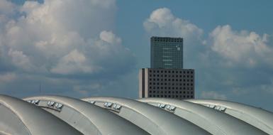 photo of the roof of the fair against the background of a skyscraper in Frankfurt city