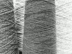 Black and white photo with close-up of the textile yarns