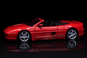 model of a red car on a black background