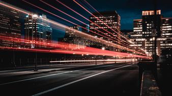 Buildings with the colorful lights, in motion, at the night, clipart