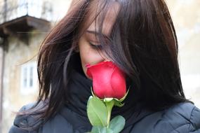 pretty girl with a rose in her hand