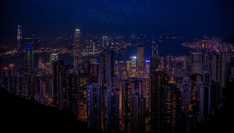 panoramic view of gong kong skyscrapers at night