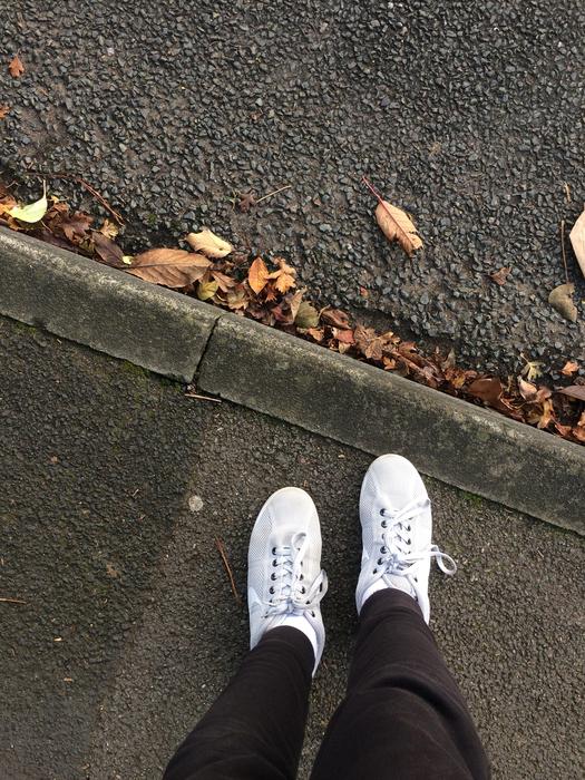 white sneakers and brown pants