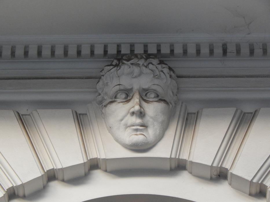 Beautiful face on the patterned architecture