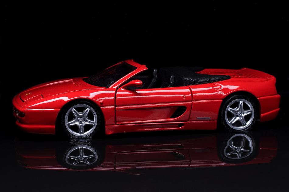 model of a red car on a black background