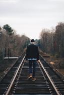 man walking on Railway Track