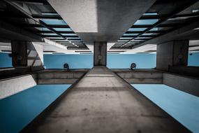 Architecture with the windows, with the reflections of the turquoise sky, with the clouds