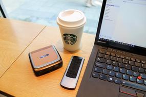 cup of coffee by the computer