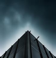 Corner of the building, under the dark sky, clipart