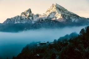 two high mountains in the clouds