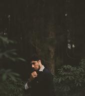 young man in the dark forest