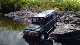 black jeep on the river bank