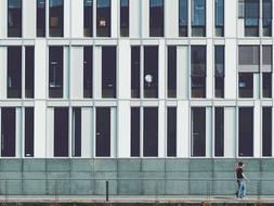 men walk near Architecture Building facade