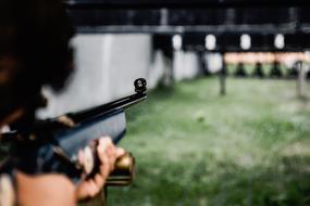 Man shooting target with Gun