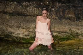 girl of model appearance in the river