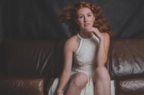 Portrait of pretty girl sitting on the couch