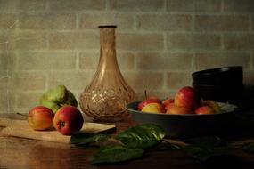 glass vase near the fruit