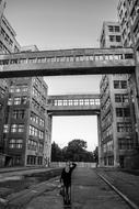 black and white, man and modern high-rise buildings