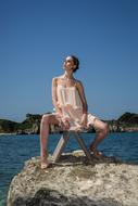 Model Mannequin Fashion on stone by the sea