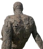 back view of old stone male Statue