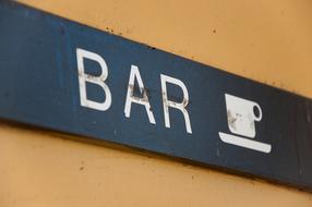 sign on the wall of the bar