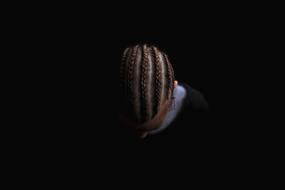 photo of the head of a guy with pigtails