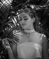 beautiful girl on a background of palm trees