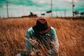 Man in Hat on field