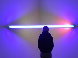 Elderly man at background of light