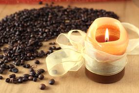 candle near the coffee beans