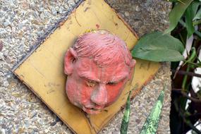 Man Head red statue