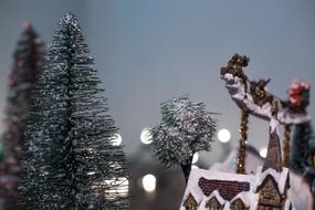 Beautiful and colorful Christmas decorations with trees, at background with bokeh lights