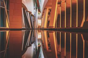 Buildings with colorful lights, and reflections in the water