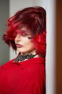 photo of a model in a red dress with red hair