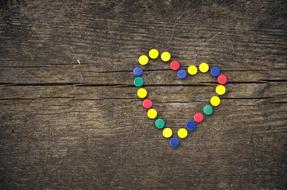 colored hearts on a wooden table