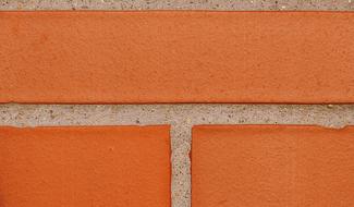 Close-up of the orange brick of the building, near the Lake Dusia