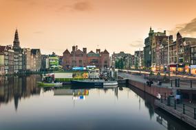 buildings and pier in the historic center in Amsterdam, Holland