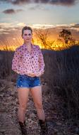 girl in short shorts outdoors at dusk