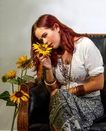 redhead Girl smelling Flowers