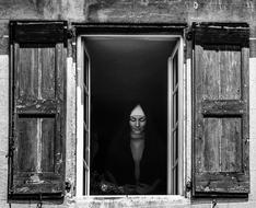 beautiful woman in wooden old window