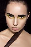 girl face with bright eye makeup