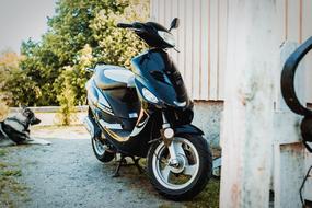 a black motorcycle against the wall