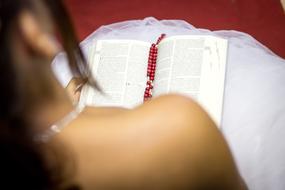Girl book red red beads
