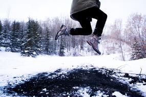 Men feet against the snow