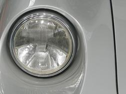 headlight on a gray car close-up